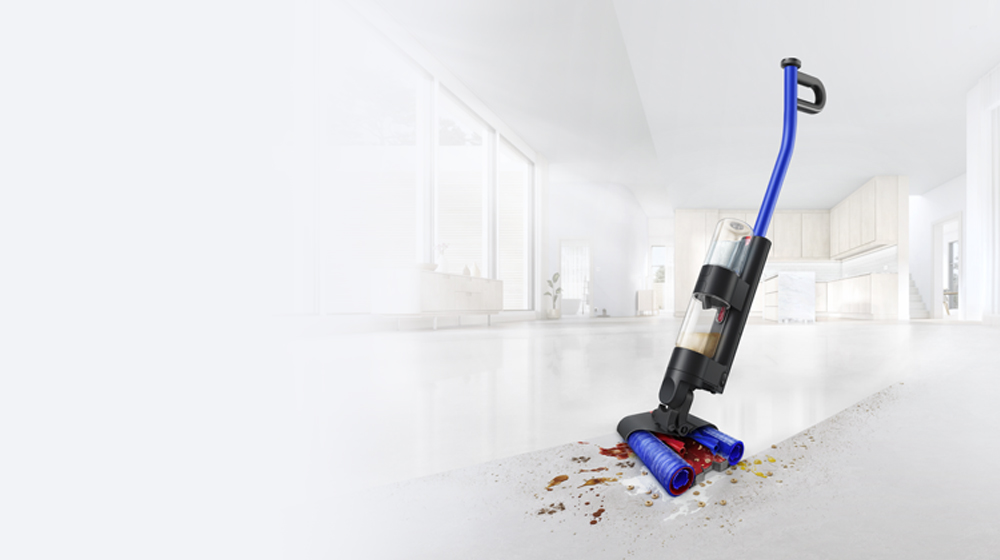 The Dyson WashG1 leaving a clean sweep through mess on a hard kitchen floor