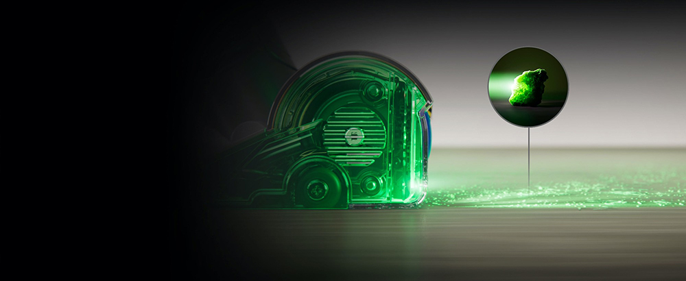 Side view of vacuum with fluorescent green light going through the cleaner head and out onto the floor.