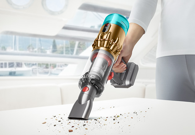 Dyson Micro vacuum cleaning a worktop.