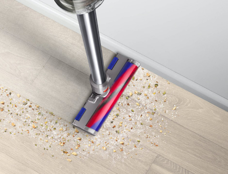 Slim Fluffy cleaner head cleaning under desk legs.