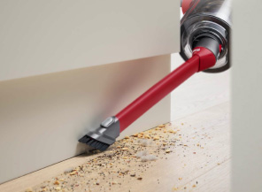 Awkward gap tool cleaning the space between a floor and a wall.