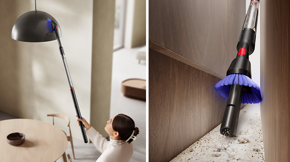 Person using Dyson Pencilvac cleaner to clean light fitting