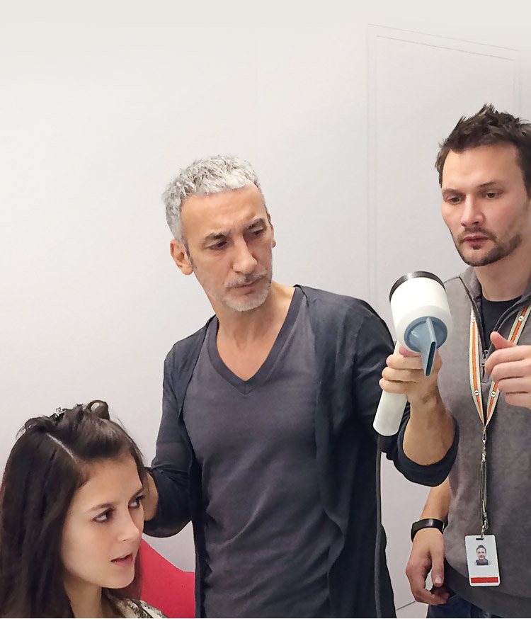 Akin Konizi,  British Hairdresser of the Year, pictured styling in the Dyson hair lab with Dyson engineer