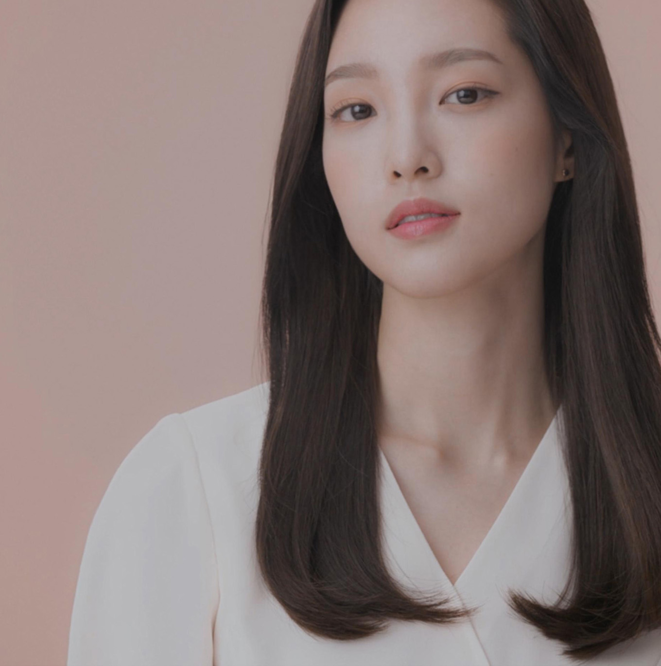 A model with long, blonde hair wearing a straight style.